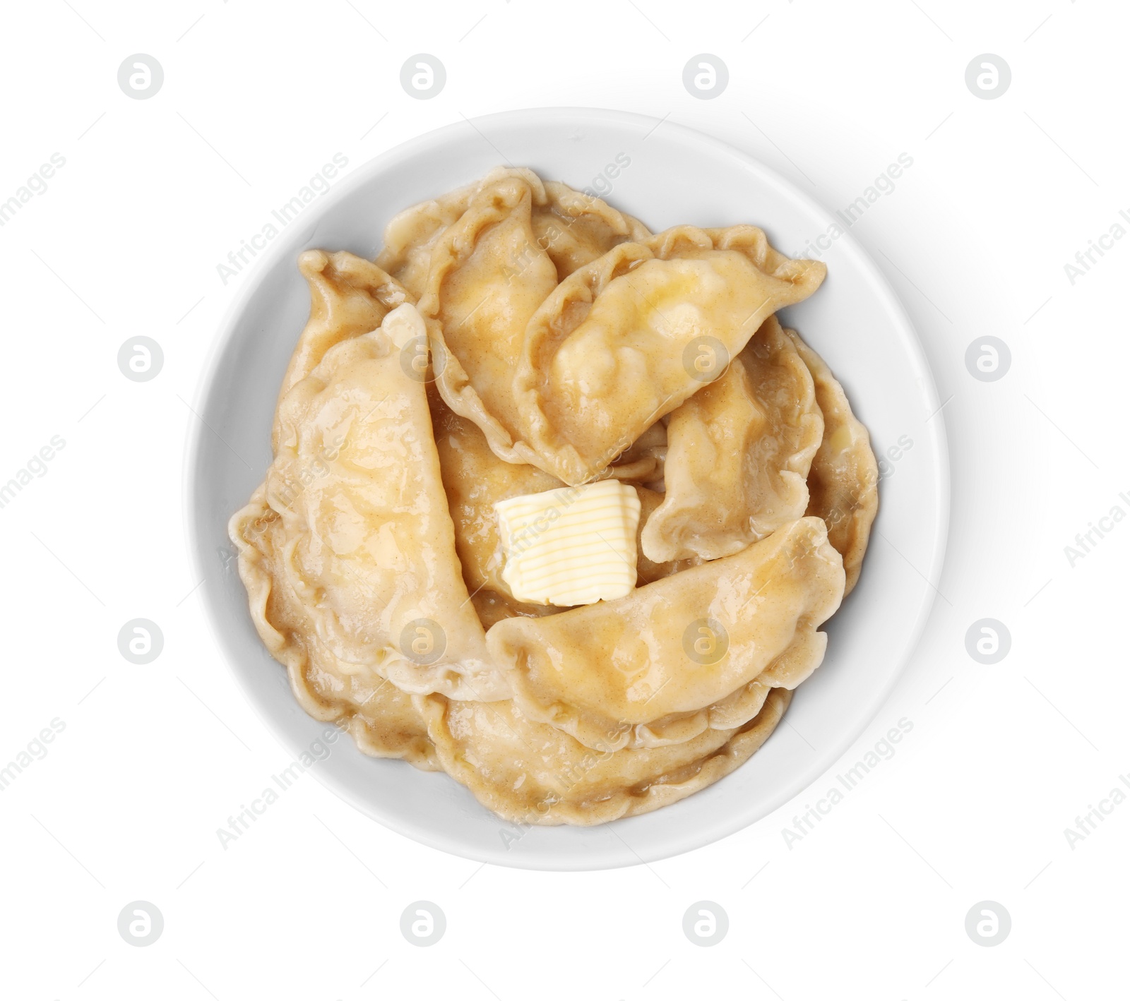 Photo of Bowl of delicious dumplings (varenyky) with cottage cheese and butter isolated on white, top view