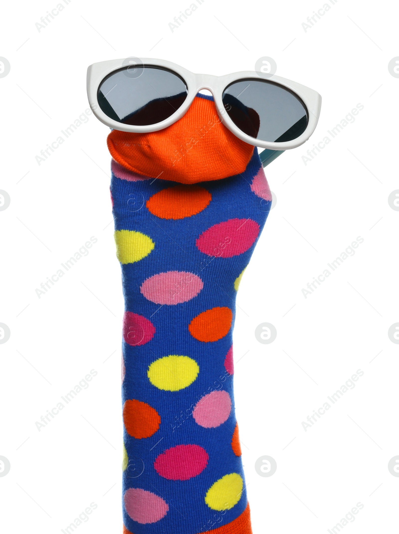 Photo of Funny sock puppet with sunglasses isolated on white