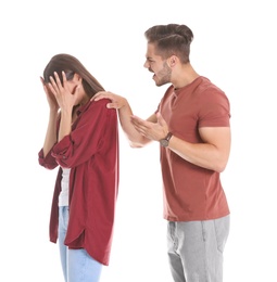 Photo of Young couple having argument on white background. Relationship problems