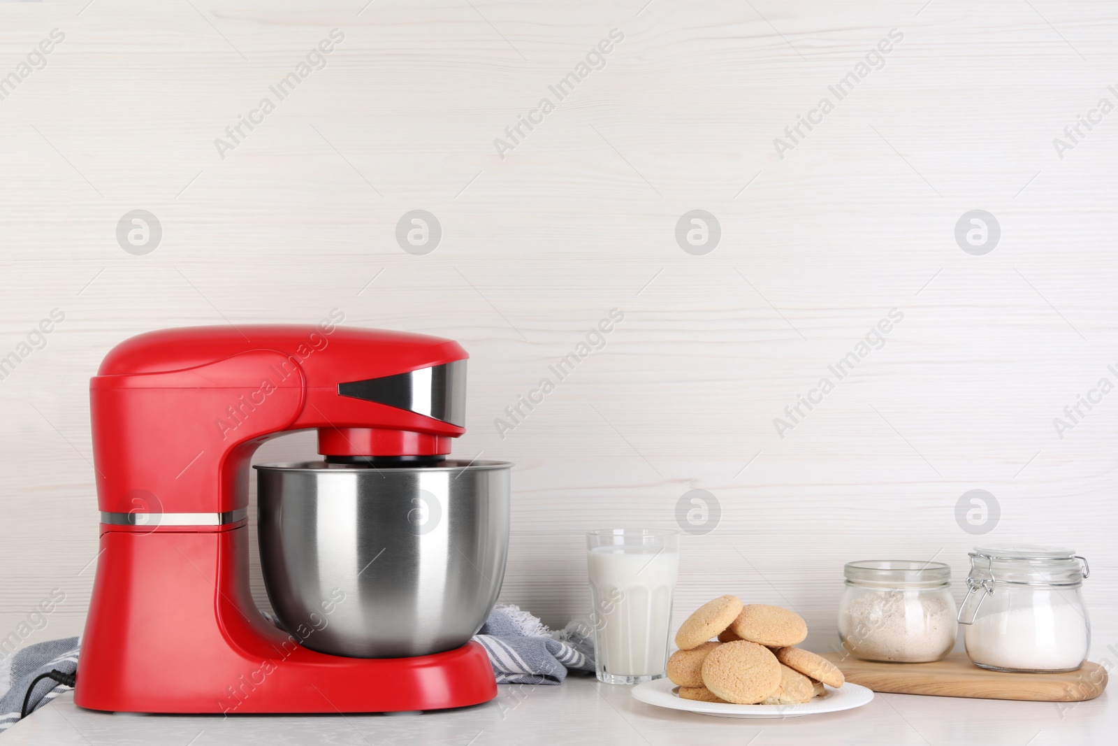 Photo of Composition with modern red stand mixer and different products on white table