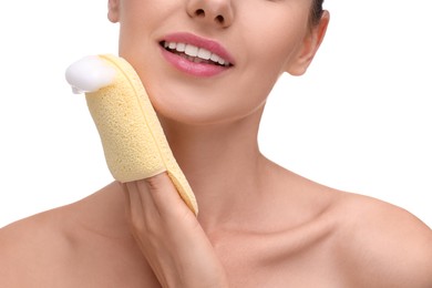 Photo of Happy young woman washing her face with sponge on white background, closeup