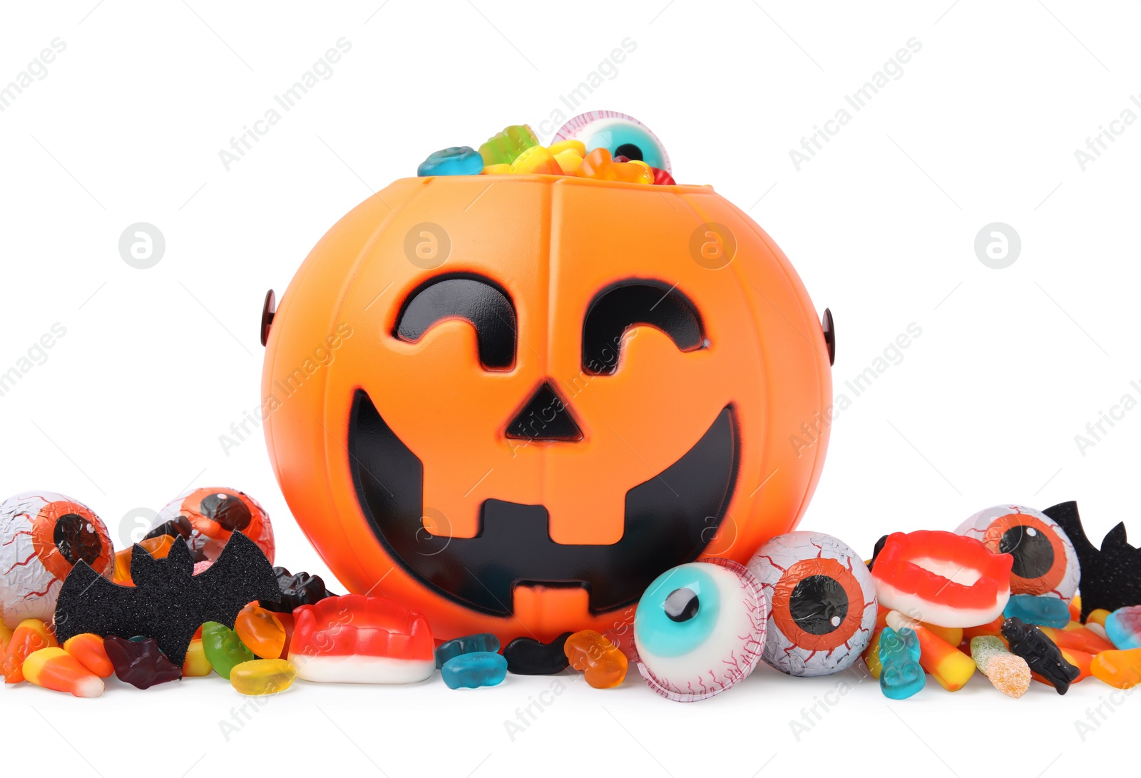 Photo of Halloween trick or treat bucket with different sweets on white background