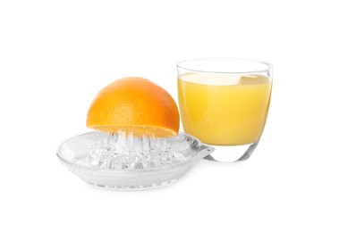 Photo of Cut ripe orange, glass of fresh juice and squeezer on white background