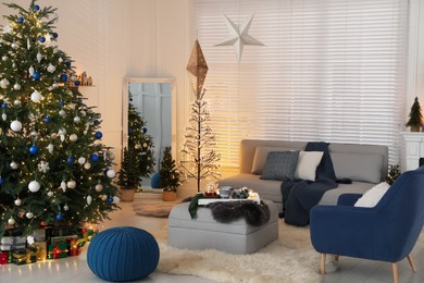 Photo of Cozy living room interior with beautiful Christmas tree and comfortable furniture