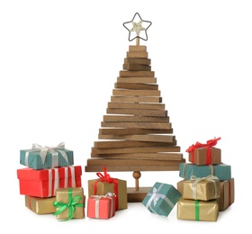 Photo of Decorative wooden Christmas tree with gift boxes on white background