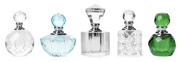 Image of Set with different bottles of luxury perfume on white background. Banner design