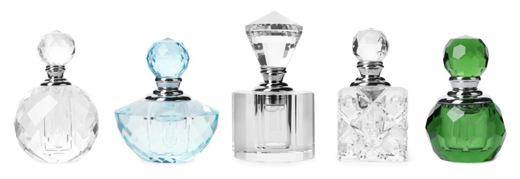 Set with different bottles of luxury perfume on white background. Banner design