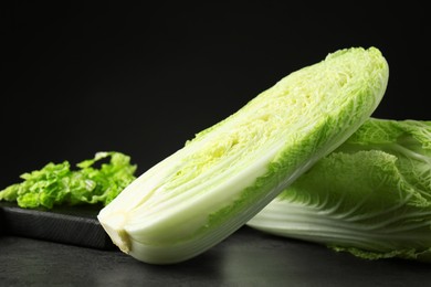 Fresh ripe Chinese cabbages on grey table