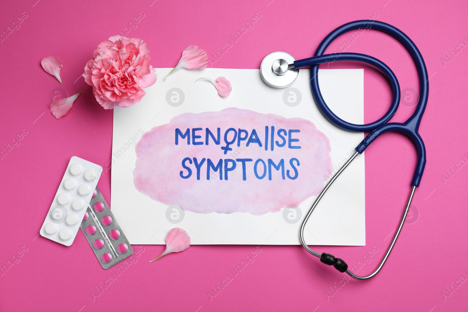 Photo of Sheet of paper with words Menopause Symptoms, stethoscope, carnation flower and pills on pink background, flat lay