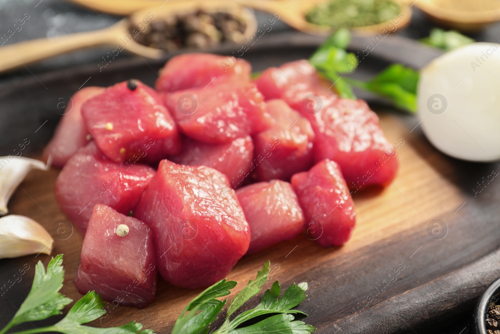 Photo of Cooking delicious goulash. Raw beef meat on board, closeup