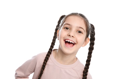 Portrait of little girl laughing on white background