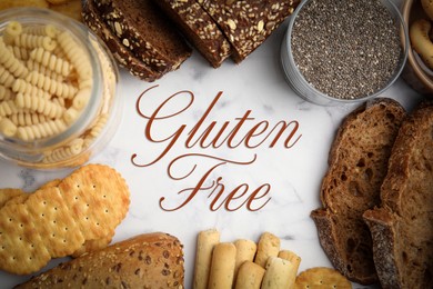 Image of Frame made of different gluten free products on white marble table, flat lay