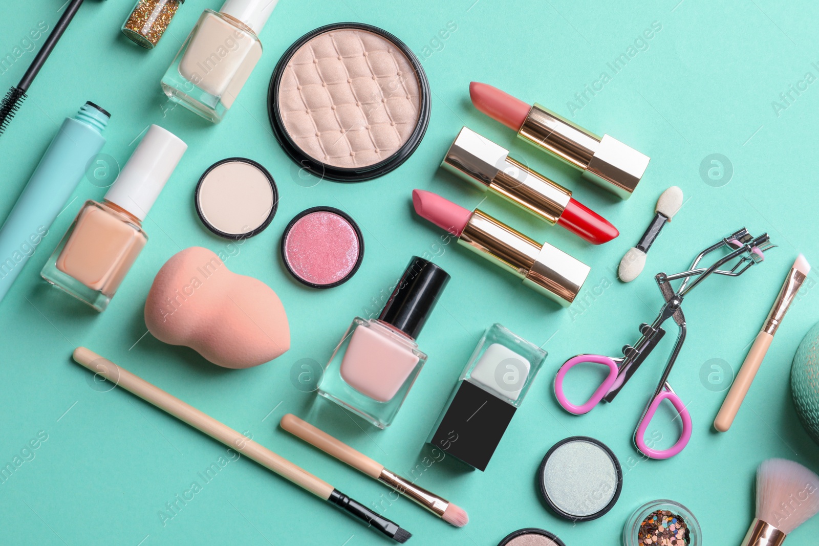 Photo of Flat lay composition with decorative cosmetics on color background