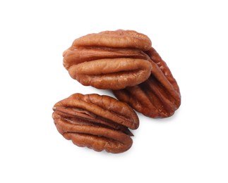 Photo of Tasty pecan nuts isolated on white, top view