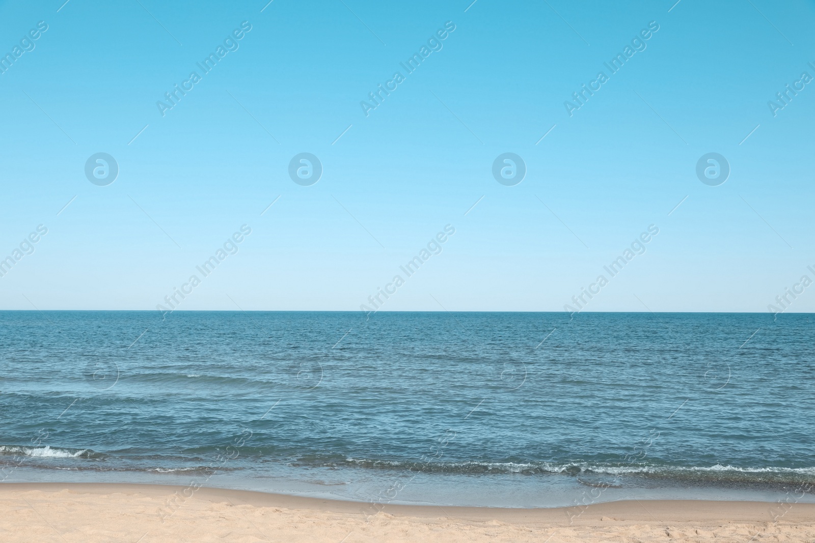 Photo of Beautiful view of sea shore under blue sky on sunny day