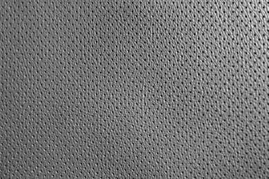 Textured grey leather as background, closeup view