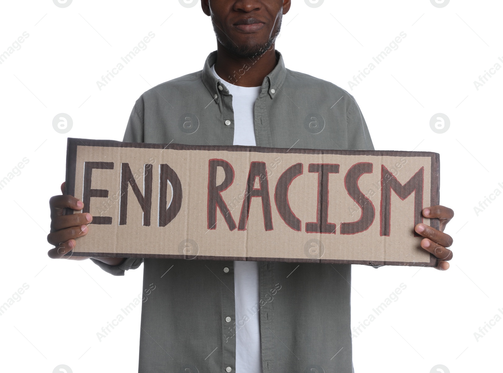 Photo of African American man holding sign with phrase End Racism on white background, closeup