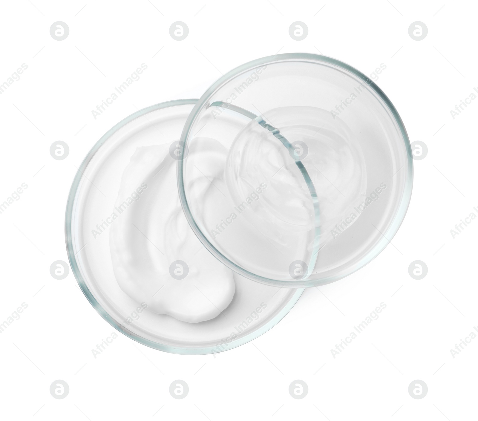 Photo of Petri dishes and cosmetic products on white background, top view