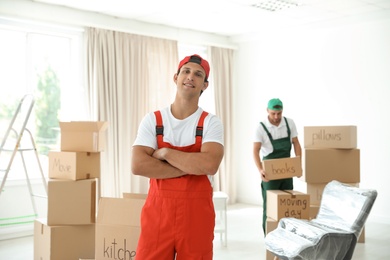 Photo of Portrait of male mover in uniform indoors