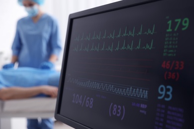 Cardiogram and data on display of heart rate monitor in clinic