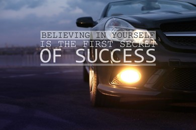 Believing In Yourself Is The First Secret Of Success. Inspirational quote saying that self confidence will bring you thriving results. Text against luxury car on road