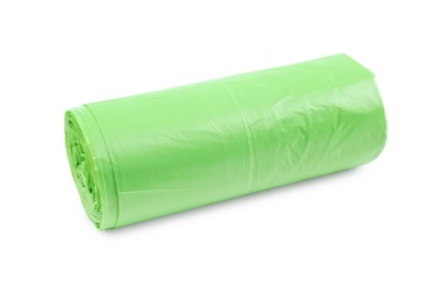 Photo of Roll of light green garbage bags isolated on white