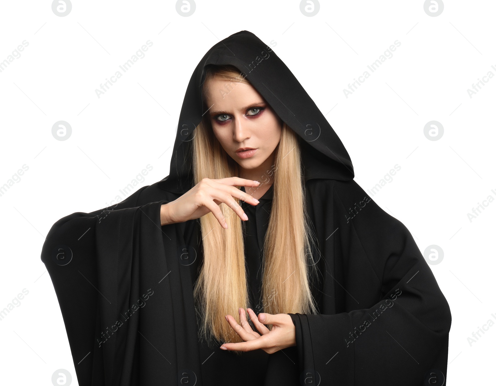 Photo of Witch in black mantle isolated on white. Scary fantasy character