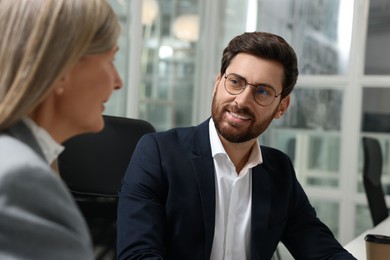 Lawyer working with colleague together in office