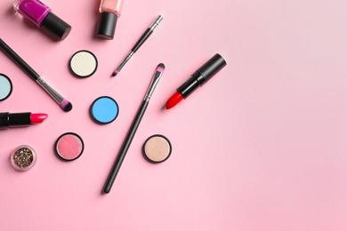 Photo of Flat lay composition with decorative cosmetics on color background