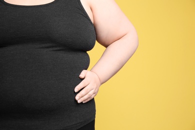 Photo of Overweight woman on color background