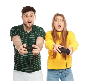 Photo of Emotional couple playing video games with controllers isolated on white