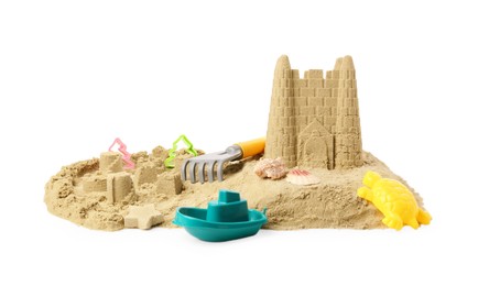 Photo of Pile of sand with beautiful castle, shells and plastic beach toys isolated on white