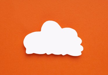 Photo of Paper speech bubble in shape of cloud on orange background, top view. Space for text