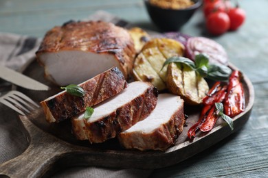 Photo of Delicious grilled meat and vegetables served on wooden table, closeup