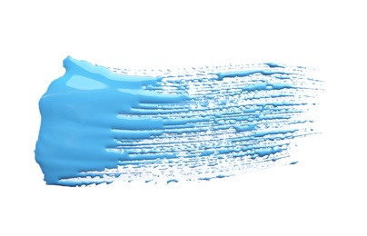 Photo of Abstract brushstroke of blue paint isolated on white