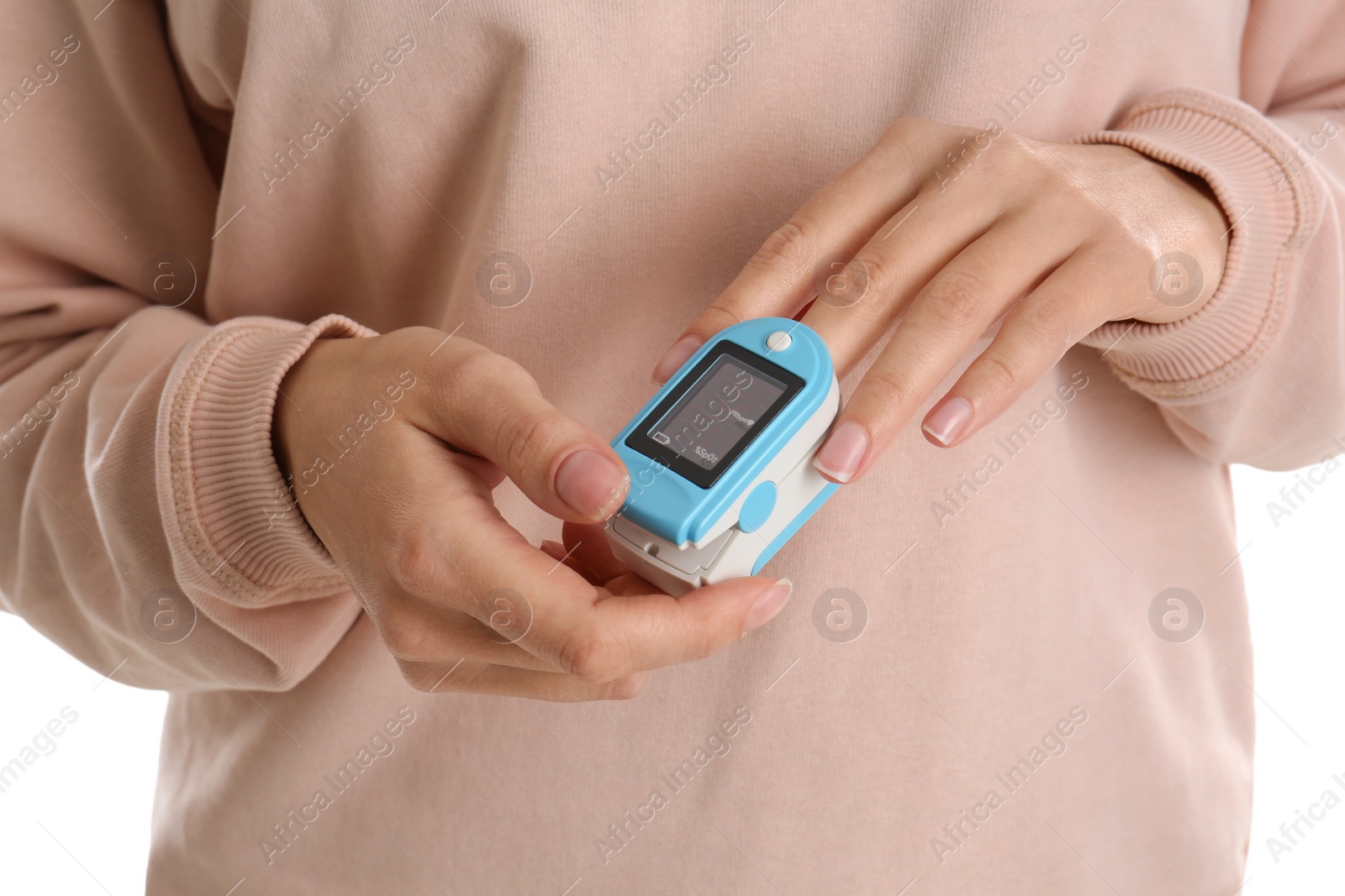 Photo of Woman using pulse oximeter for oxygen level testing on white background, closeup