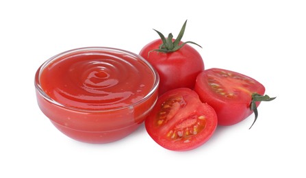 Photo of Bowl with tasty ketchup and fresh tomatoes isolated on white