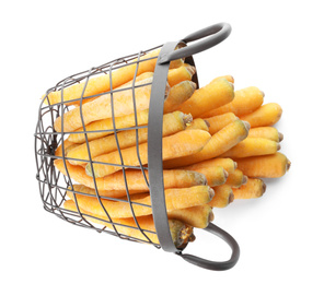 Photo of Raw yellow carrots in metal basket isolated on white, top view