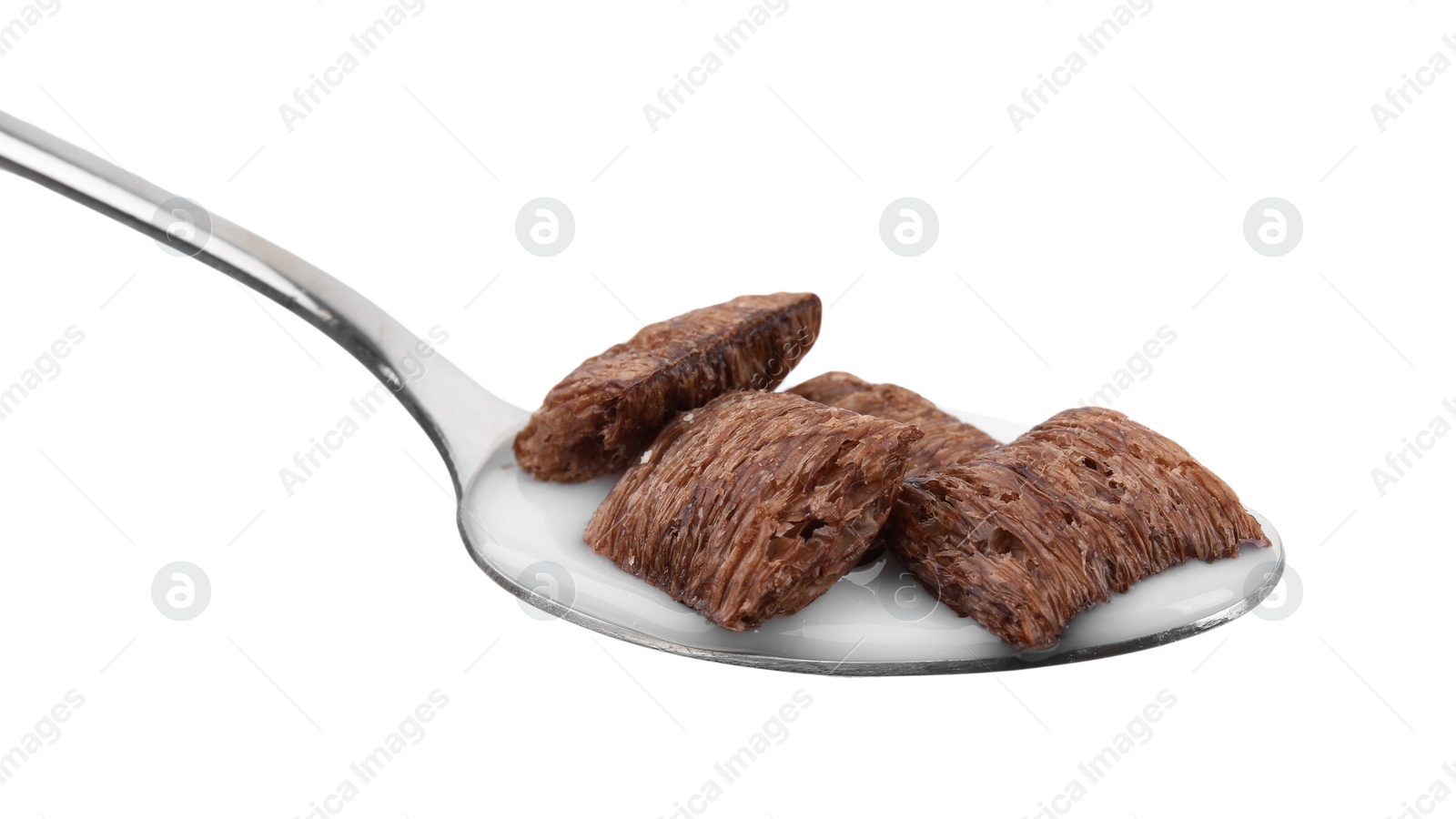 Photo of Chocolate cereal pads and milk in spoon isolated on white