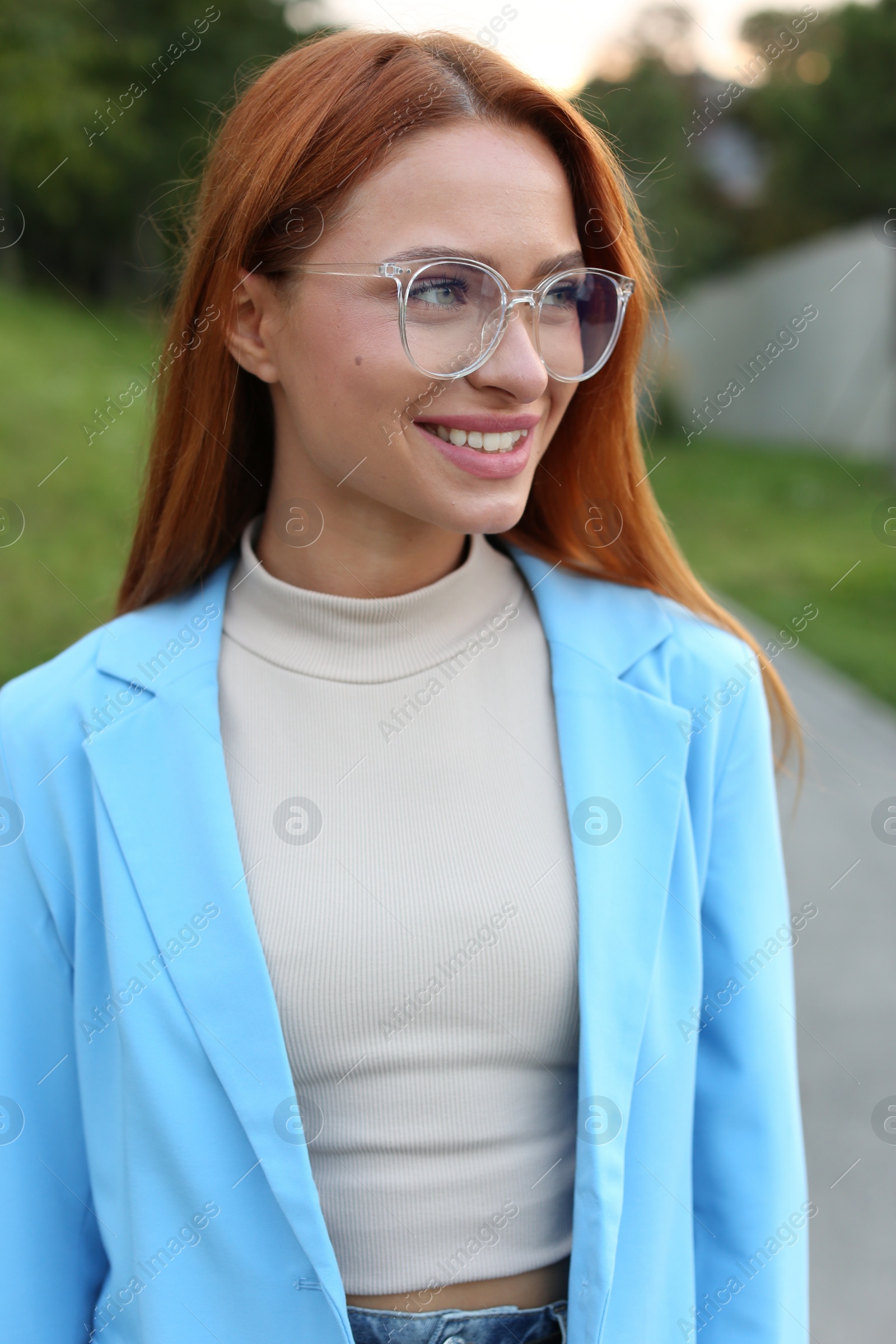 Photo of Portrait of beautiful woman in glasses outdoors