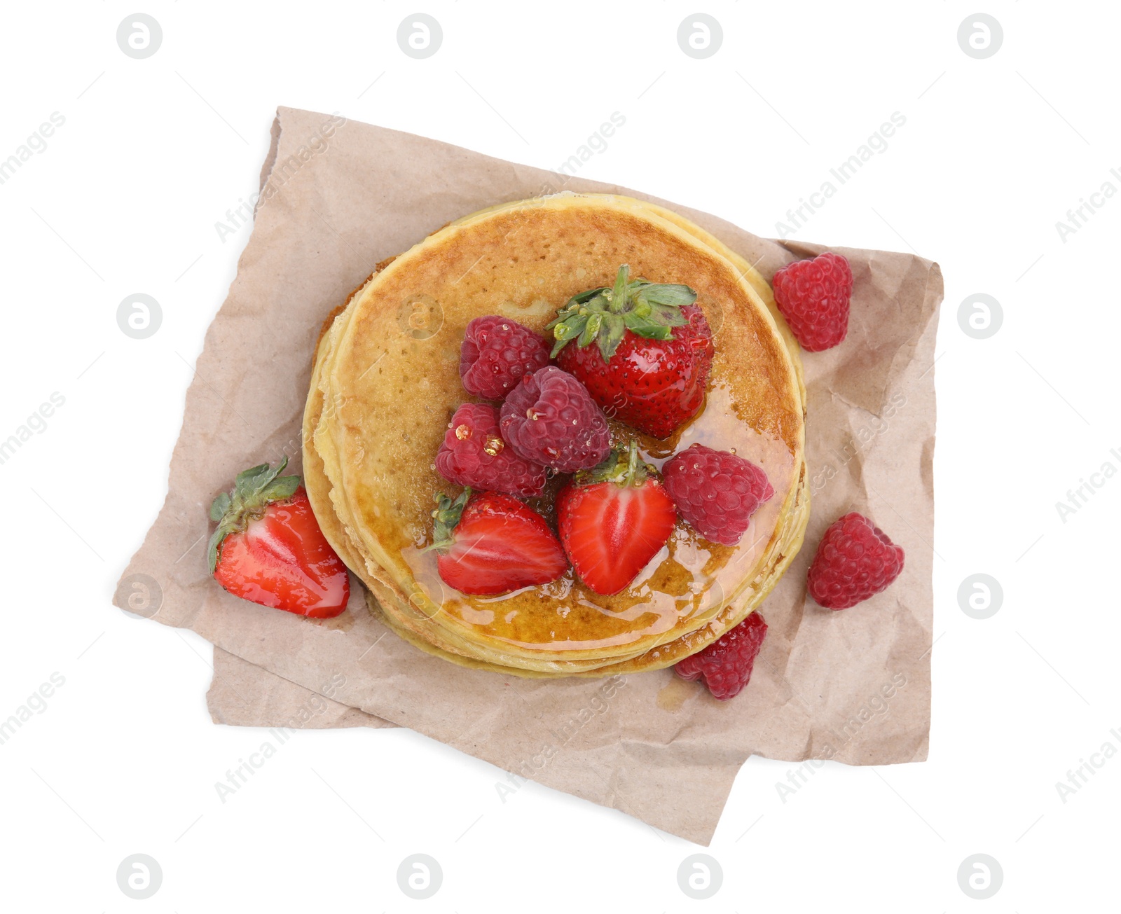 Photo of Tasty pancakes with fresh berries and honey on white background, top view