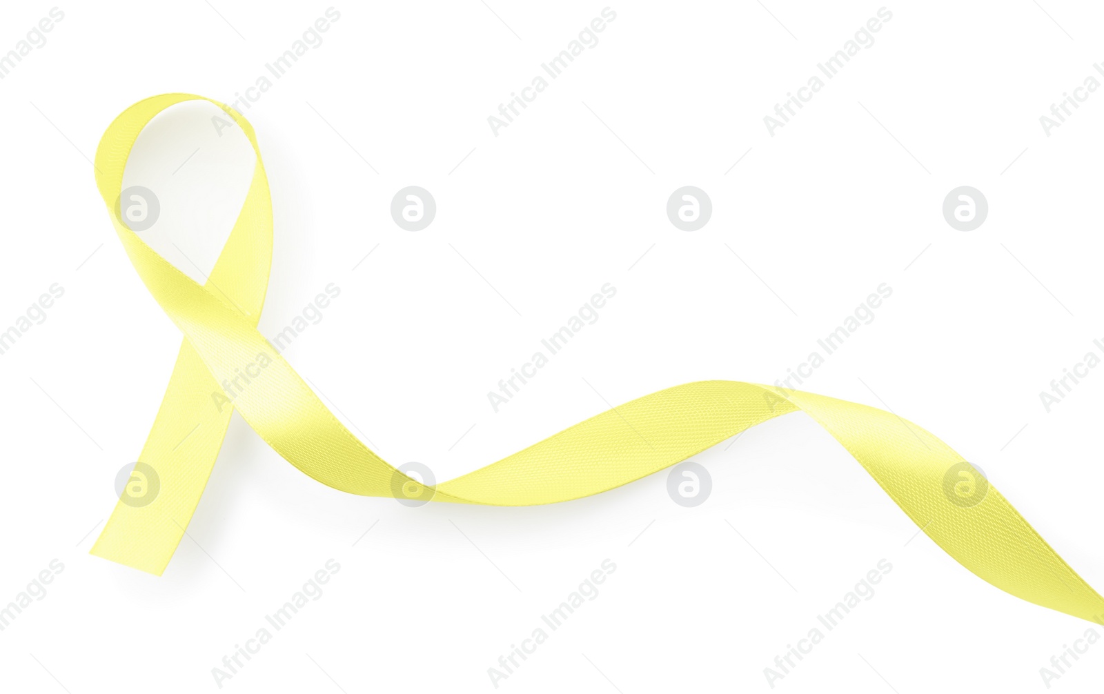 Photo of Yellow awareness ribbon isolated on white, top view