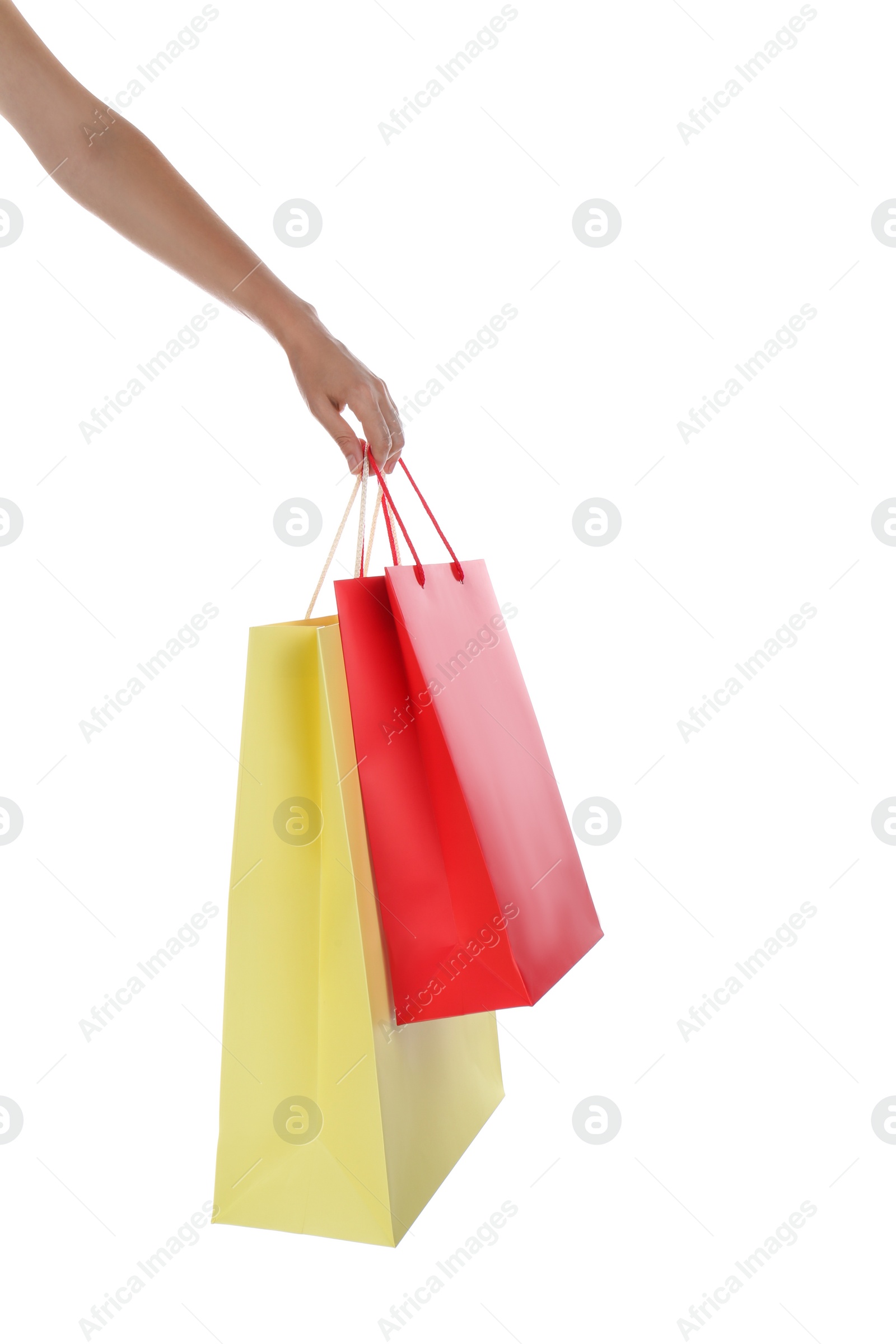 Photo of Woman with paper shopping bags on white background, closeup