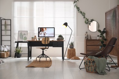 Stylish home office interior with comfortable workplace