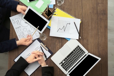 Photo of Business trainer and client working in office, closeup