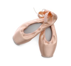 Photo of Beautiful beige ballet shoes isolated on white, top view