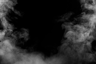 Image of White smoke on black background. Space for text