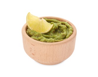 Photo of Bowl of delicious guacamole and lime isolated on white