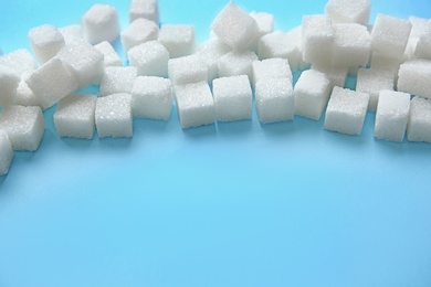 Photo of Refined sugar on color background