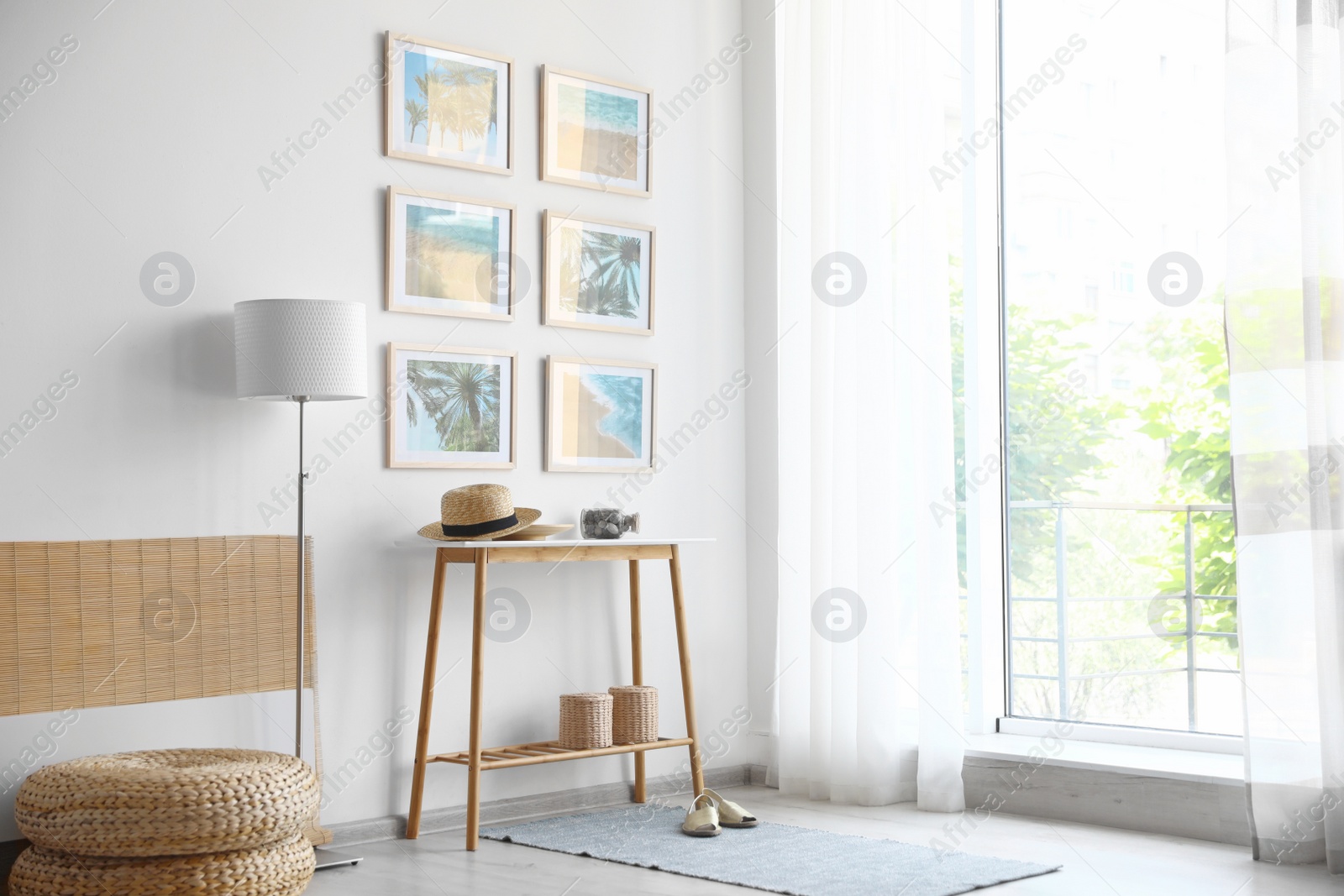 Photo of Stylish room interior with trendy furniture and pictures on wall